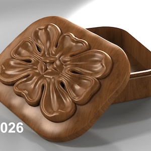 May include: A wooden box with a carved flower design on the lid. The lid is open, revealing the empty interior of the box. The box is labeled "JR026".