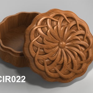 May include: A wooden box with a carved floral design on the lid. The box is open and the inside is empty.