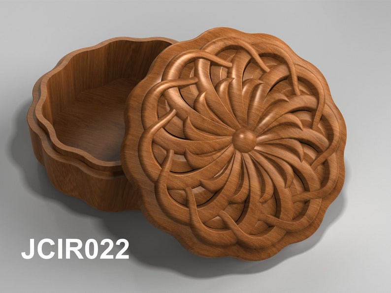 May include: A wooden box with a carved floral design on the lid. The box is open and the inside is empty.