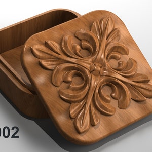 May include: A wooden box with a carved floral design on the lid. The box is open and the inside is visible. The box is labeled "JS002".