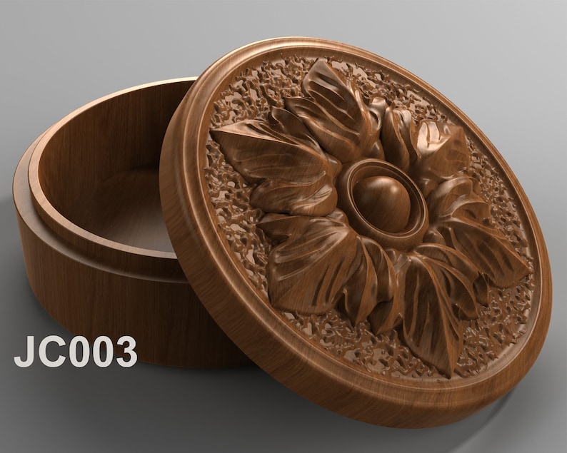 May include: A wooden box with a carved floral design on the lid. The box is open and the inside is visible. The box is labeled "JC003".