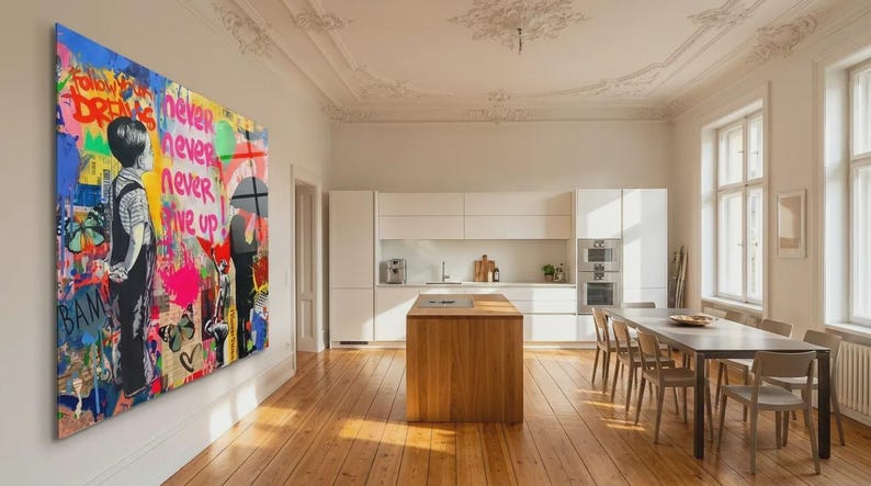 May include: A large, colorful wall art piece with graffiti-style artwork. The art features a child figure, butterflies, hearts, and the words "Follow Your Dreams" and "Never Give Up." The artwork is displayed in a modern, well-lit dining room.