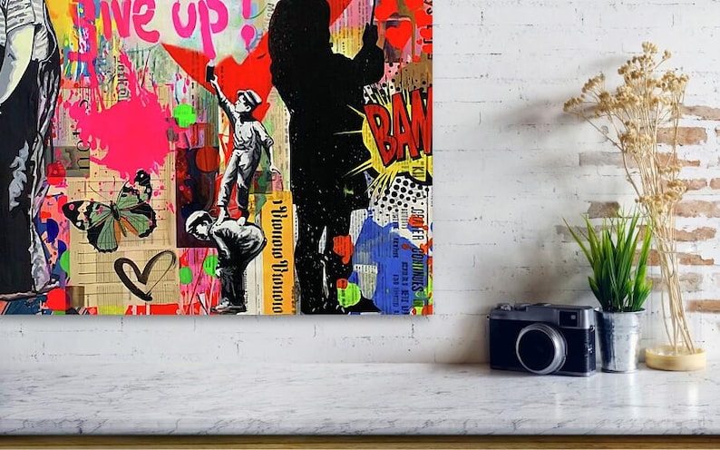 May include: A vibrant mixed-media artwork featuring graffiti-style elements. The piece includes a silhouetted figure, cartoon-style speech bubbles, and the word "Give up!" in pink. A butterfly and heart are also visible.