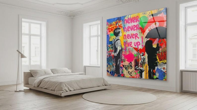 May include: A large, colorful wall art piece with graffiti-style art, featuring the words "never give up." The artwork depicts two figures, one holding an umbrella. The room also includes a bed, a floor lamp, and a round rug.