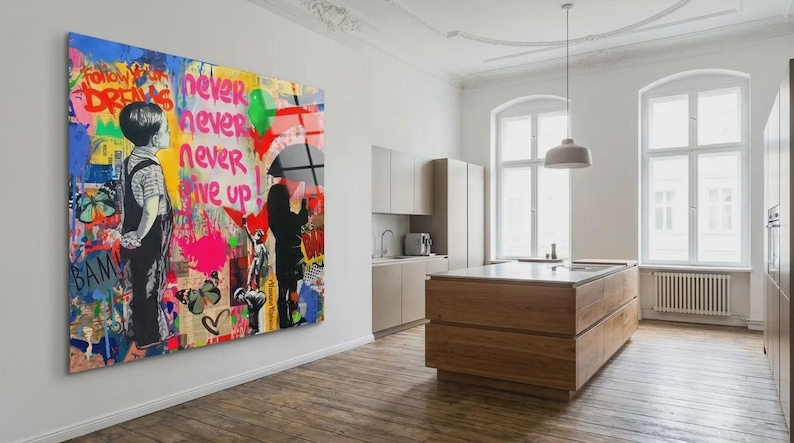 May include: A large, colorful Banksy-style artwork on a wall. The artwork features a child looking up, a figure with an umbrella, and the words "Follow Your Dreams" and "Never Give Up." The background is a mix of colors.