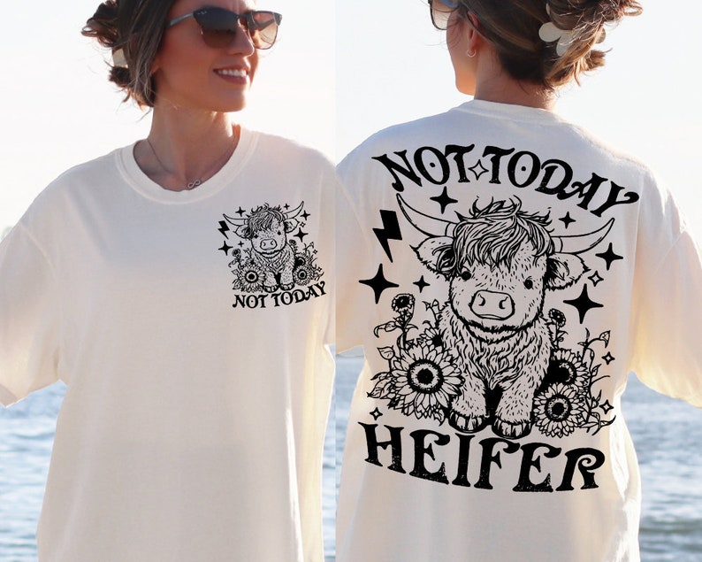 May include: White t-shirt with a black and white illustration of a Highland cow with the text "Not Today Heifer" on the back.
