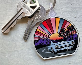 Portachiavi auto d&#39;epoca: portachiavi in acrilico con tramonto nel deserto, occhi luminosi
