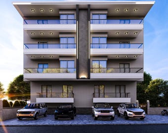 May include: A modern multi-story apartment building with balconies and glass railings. The building has a gray exterior with white trim and is illuminated by recessed lighting. Several cars are parked in front of the building on a paved surface.