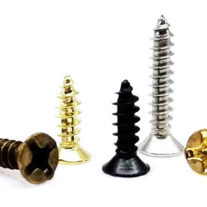 May include: Assortment of screws in various finishes, including gold, silver, and black. The screws have a cross-head design and are commonly used for fastening.