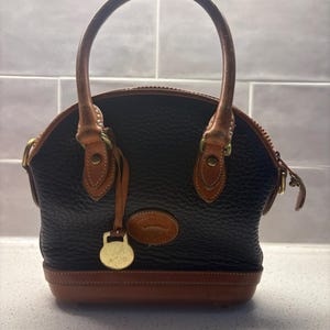 Vintage Dooney and Bourke Black and Brown Pebbled Leather Top Handle Bag