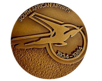 Rara medalla conmemorativa de bronce para coleccionistas, con motivo del 50 aniversario de la fundación de South African Airways. Portugal, 1984. Souvenir.