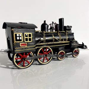 Metal steam locomotive, handmade decorative train model, retro industrial style, collectible home decor, unique gift, artisan crafted