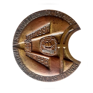 May include: A bronze-toned commemorative medal with Portuguese text. The medal is inscribed with "ESCOLA POLYTECHNICA" and "FACULDADE DE CIENCIAS". It also displays the years 1837-1987 and 1911-1986, a ship emblem, and the text "150 ANOS".