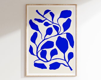 May include: A framed print with a blue abstract floral design on a cream background.
