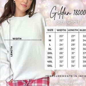 May include: Size chart for Gildan 18000 heavy blended crewneck sweatshirt. The chart shows measurements in inches for sizes S through 5XL, including width, length, and sleeve length.