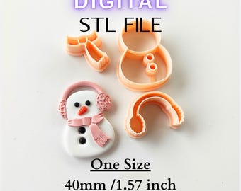 May include: A digital STL file for a snowman-themed design. The image shows a snowman with a pink scarf and earmuffs, along with several orange cookie cutters. The text on the image says "DIGITAL STL FILE" and "One Size 40mm / 1.57 inch".