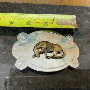 Silver and bronze belt buckle horse scene