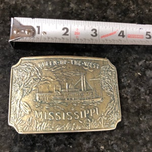 brass belt buckle of queen of the west river boat