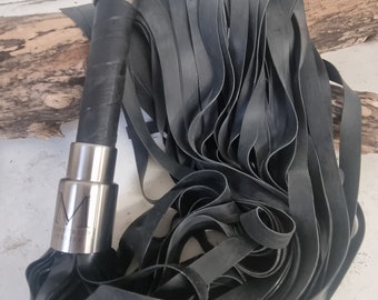 Flogger with latex and stainless steel handle