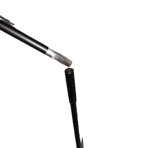 May include: A black microphone stand with a black microphone attached to the top.