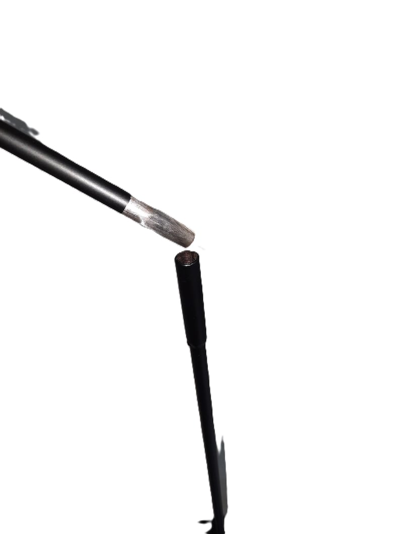 May include: A black microphone stand with a black microphone attached to the top.
