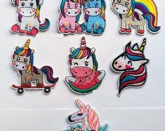 May include: Nine embroidered iron-on patches featuring colorful unicorns in various poses. The unicorns are wearing accessories like headphones, a watermelon, and a skateboard. Some unicorns are holding hands.