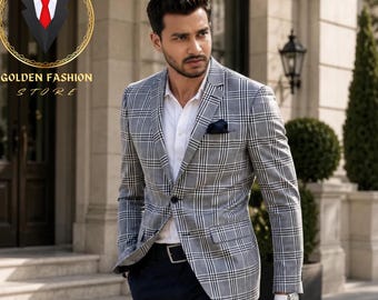 May include: A man's gray plaid blazer with a white shirt, navy blue pants, and black shoes. The blazer has a pocket square. The Golden Fashion Store logo is in the upper left corner.
