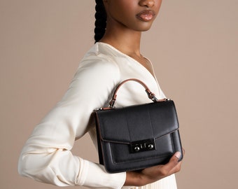 Designer Handbags -CLAUDIO CIVITICO handheld, crossbody, or over-the-shoulder bag. Black color evening purse.