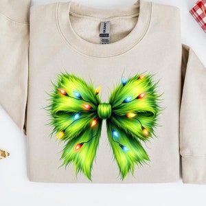 Green Grinch Christmas Coquette Bow Shirt | Grinch Christmas Sweaters | Trendy Xmas Grinchmas Shirt | Women&#39;s Christmas Bow Shirt