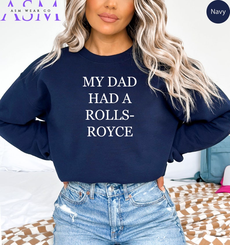 May include: A navy blue sweatshirt with the text "My Dad Had A Rolls-Royce" printed in white.