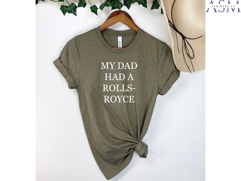 May include: A green t-shirt with the text "My Dad Had A Rolls-Royce" printed in white.