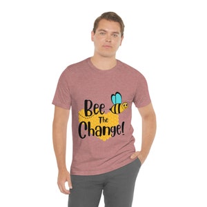 Bee The Change Bumble Honey Comb  Fun Pun Unisex Jersey Short Sleeve Tee Silly