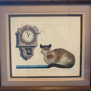 May include: Framed print featuring a cat and a clock. The cat is brown, black, and white, facing away from the viewer. A clock with Roman numerals and two mice is on the left. The text "TIME WAITS FOR NO MOUSE" is below.