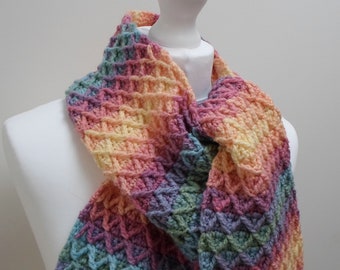 Crochet scarf: handmade scarf in rainbow ombre gradient stripes, decorated with a raised zig-zag pattern