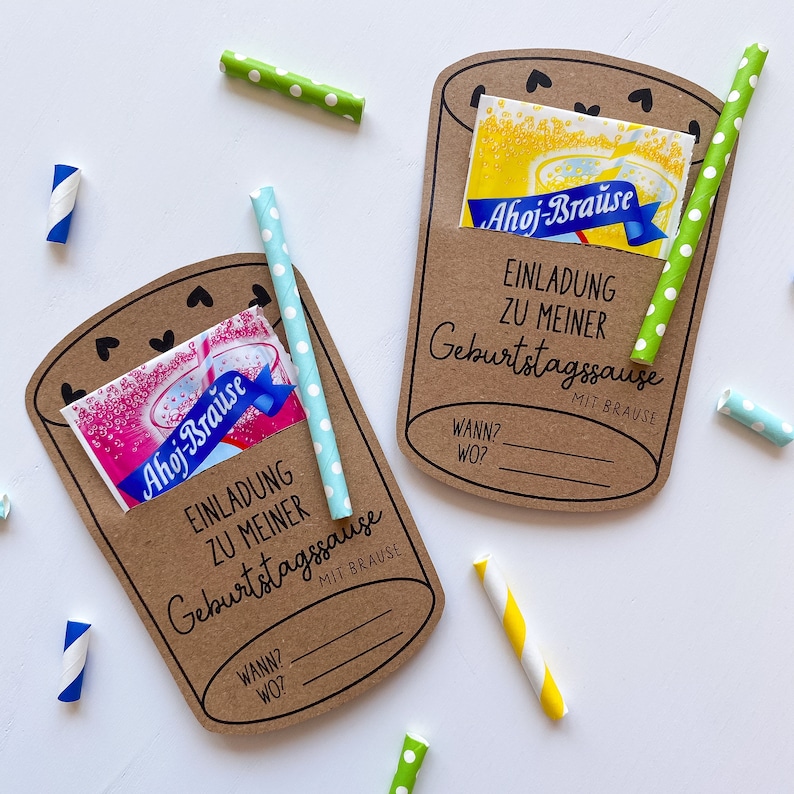 May include: Two brown paper invitations shaped like glasses with a straw and a packet of powdered drink mix. The text on the invitations reads "Einladung zu meiner Geburtstagssause mit Brause" which translates to "Invitation to my birthday party with soda".