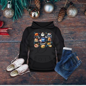 May include: Black hoodie with a white graphic of holiday food and the text "Tis the Season".