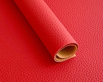 May include: A roll of red faux leather with a textured surface.
