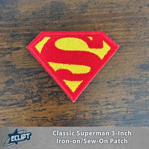 May include: A red and yellow Superman logo patch. The patch is diamond-shaped with a yellow "S" on a red background. The patch is 3 inches in size and can be ironed on or sewn on.