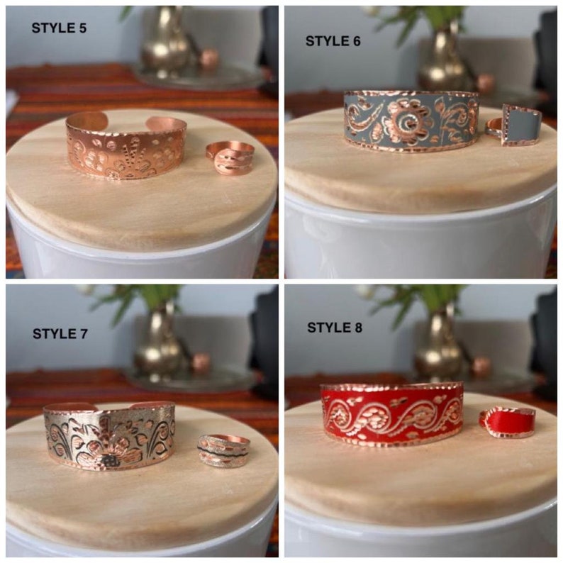 May include: Four sets of copper bracelets and rings with different colored enamel designs. The bracelets are all the same size and shape, but the enamel designs are different. The rings are all the same size and shape, but the enamel designs are different. The bracelets and rings are all made of copper and have a shiny finish. The enamel designs are all very intricate and detailed. The bracelets and rings are all very beautiful and would make a great gift for someone special.