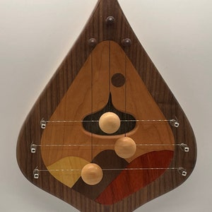 DH3WBCDEC- Handmade Swedish 3 string door harp with Walnut border and decorative Cherry inlay.