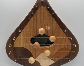 DH5WBCDEC-5 string door harp with solid Walnut border and decorative Cherry inlay. Personalization available.