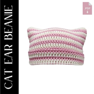 Può includere: Berretto lavorato a uncinetto a righe rosa e bianche con orecchie da gatto.