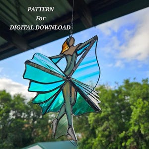 May include: Stained glass figure of a dancer with a teal dress and orange hair, hanging from a wire. The figure is in a graceful pose, with arms outstretched. Text above reads "PATTERN For DIGITAL DOWNLOAD".