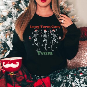 Long Term Care Team Group Christmas Sweatshirt, Funny Nurse Christmas Sweater, Group Registered Nurse Sweatshirt, Nurse Holiday Sweater