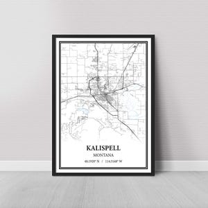 May include: Black and white map print of Kalispell, Montana. The map shows the city streets and surrounding area. The text "Kalispell, Montana 48.1920° N / 114.3168° W" is printed at the bottom of the map.