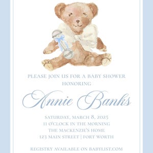 May include: A baby shower invitation with a watercolor illustration of a teddy bear holding a rattle. The invitation says "We can Bear-ly wait..." and includes the name "Annie Banks", the date "Saturday, March 8, 2025", the time "11 o'clock in the morning", the location "The Mackenzie's Home, 123 Main Street | Fort Worth", and the registry information "Registry available on Babylist.com".
