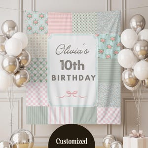 May include: A pastel-coloured patchwork birthday backdrop with the text "Olivia's 10th Birthday." The design includes floral, striped, and checkered patterns. Silver and white balloons are arranged on either side of the backdrop.
