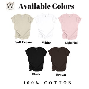 May include: Six different colour t-shirts with ruffled edges. The colours are soft cream, white, light pink, black, brown, and grey. The text "Available Colors" is at the top of the image. The text "100% COTTON" is at the bottom of the image.