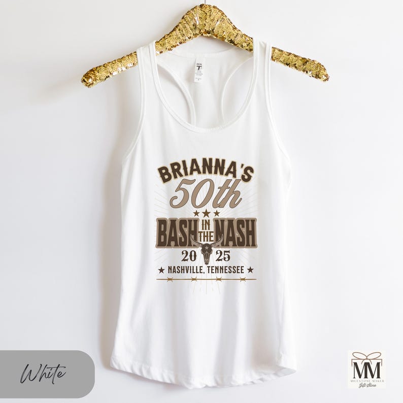 May include: White tank top with a brown graphic that says "Brianna's 50th Bash in the Mash" with a star, a bull skull, and the text "20 25 Nashville, Tennessee" underneath.