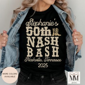 May include: Black t-shirt with gold text that reads "Stephanie's 50th NASH BASH Nashville, Tennessee 2025".
